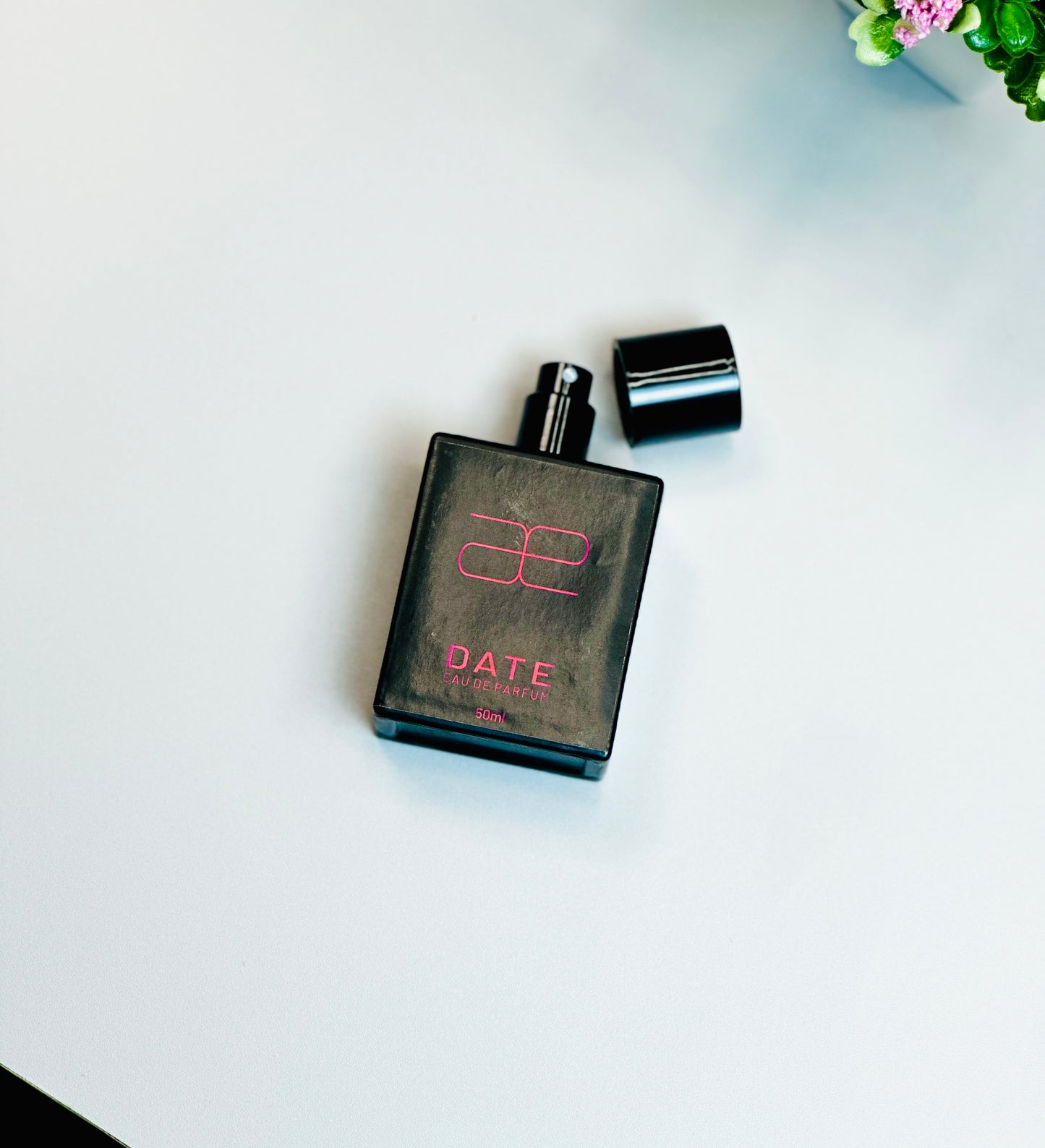 Blaek Date perfume in a sleek bottle with a luxurious design.