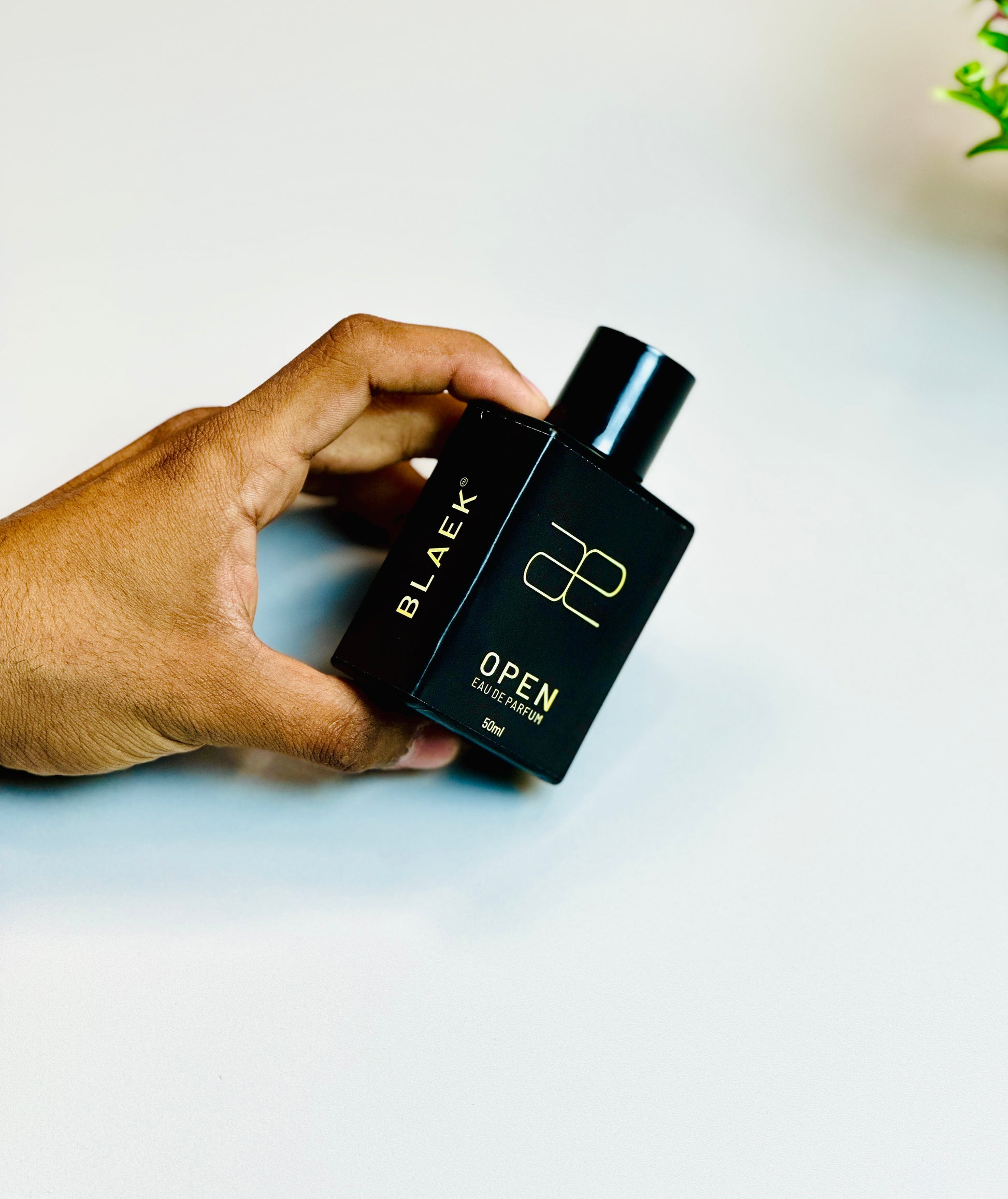 Blaek Open Perfume: Elegant packaging with a refreshing citrus scent.