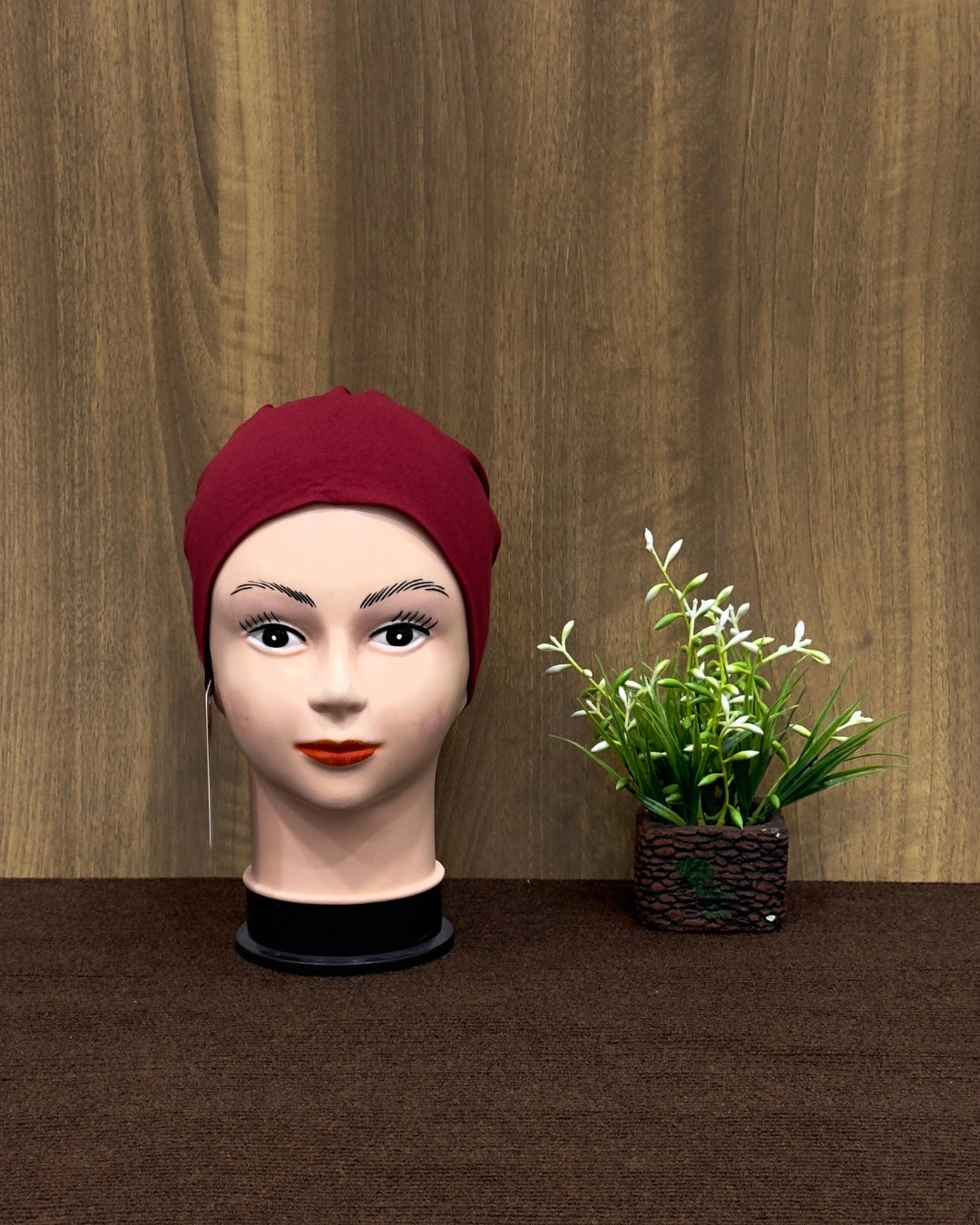 Front-facing cherry hijab tube cap for styling.