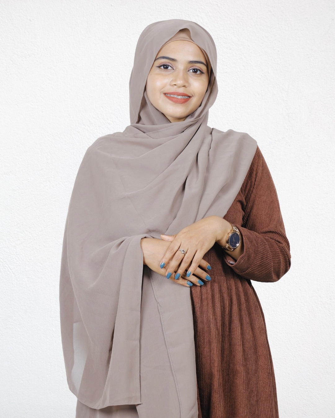 "A woman styling a Dust Storm Chiffon Scarf, showcasing its lightweight and flowy design.