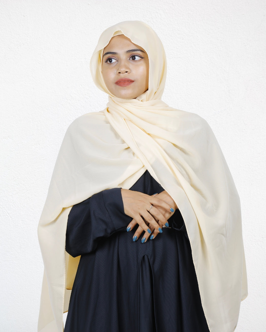 The vanilla chiffon scarf adds a gentle touch of elegance to any look.